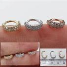 Argola clicker triple hélix em ouro 18k com zircônias suiças