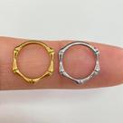 Argola titânio bones clicker dourada com fecho clicker