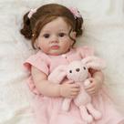 Boneca Bebê Reborn Silicone 55cm Menina Olho Castanho Vestido rosa com Acessórios Brastoy