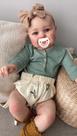 Boneca Reborn Baby Doll Anano Newborn 60 cm de silicone com roupa e acessórios.