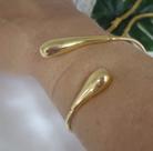Bracelete "gotas". Peça banhada a ouro, detalhe gotas nas pontas.