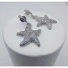 Brinco concha cravejado com micro zircônia banhado a rhodium