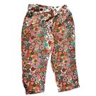 Calça Beta - estampa floral com amarração na frente.
