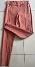 calça modelo alfaiataria tecido em elastano cor rosa clara tamanho m