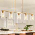 Candelabro Mecgirn Island em ouro escovado claro com 5 luzes