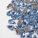 Chaton Engrampado Gota 8x13mm Azul Claro - 100 peças32g Chaton Engrampado Gota 8x13mm Azul Claro - 100 peças32g