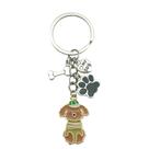 Chaveiro Creative Dog com chapéu, estampa de pata e pingente ósseo Chaveiro Creative Dog com chapéu, estampa de pata e pingente ósseo