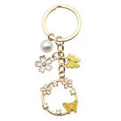 Chaveiro Flor de Borboleta Amarela com Pérola e Strass Chaveiro Flor de Borboleta Amarela com Pérola e Strass