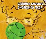 Chiclete grudado embaixo da mesa