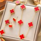 Conjunto de três peças de colar pulseira e brincos de flor de quatro folhas em aço titânio 18K