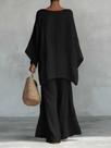 Conjunto feminino composto por blusa folgada e calça pantalona.