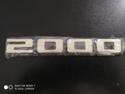 Emblema 2000 preto e prata material acrílico