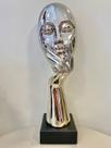 Escultura face