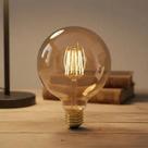 Lampada Bola Decorativa Luz Quente Filamento E27 Lampada Bola Decorativa Luz Quente Filamento E27