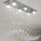 Lustre de Cristal para mesa de jantar com 70cm de altura e base de inox espelhado de 70x20cm