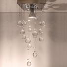 Lustre em cristais K9 para lavabo com 30cm de altura e base de inox espelhada de 14x14cm