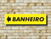 Placa Aviso Banheiro Seta Esquerda Amarela