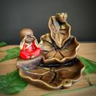 Porta incenso cascata folhas com buda vermelho 12cm