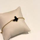 Pulseira borboletas com resina preta banhado em ouro 18k