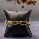 Pulseira com elos medindo 22 cm de comprimento, incluído extensor. Banhada a ouro 18k