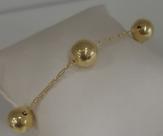 Pulseira corrente e bolas , banhada em ouro.