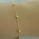 Pulseira infantil de bolinha em ouro 18k