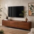 Rack para TV Até 75" 2 Gavetas 2 Portas Jasper 220 cm - Canella c/ Champanhe Rack para TV Até 75" 2 Gavetas 2 Portas Jasper 220 cm - Canella c/ Champanhe