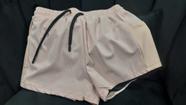 Short feminino rosa claro