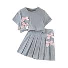 Terno da moda para meninas, camiseta curta e saia plissada com laço rosa, roupas doces