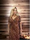 Vestido Longo na cor onça estampado, no tecido malha, veste no tamanho único 40 ao 44.
