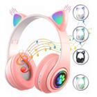 Fone de ouvido over-ear gamer sem fio CAT STN-28 rosa com luz LED - King