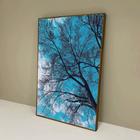 Quadro decorativo Galhos com céu Azul.