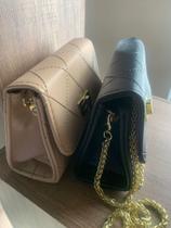 A bolsa Miss Dong tira colo