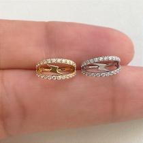 Argola aço cirúrgico double raio clicker dourada com zircônias