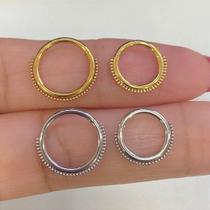 Argola aço dotz clicker dourada com fecho clicker