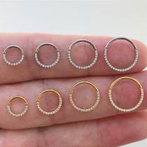 Argola clicker de titânio com zircônias frontais