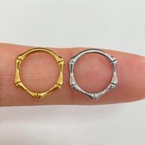 Argola titânio bones clicker dourada com fecho clicker Argola titânio bones clicker dourada com fecho clicker