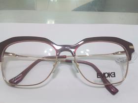 Armação dourada com acetato