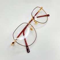 Armação Óculos de Grau Hexagonal Dourado com Hastes Vinho Elegância e Leveza em Cada Detalhe