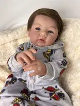 Bebê reborn artesanal menino com chupeta e mamadeira