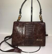 Bolsa de couro vegetal transversal com opcoes de alça Bolsa de couro vegetal transversal com opcoes de alça