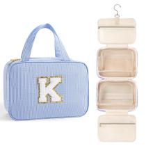 Bolsa de higiene de viagem suspensa TOPEAST para mulheres, letra azul K Bolsa de higiene de viagem suspensa TOPEAST para mulheres, letra azul K