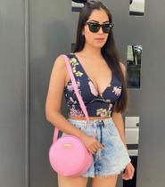 Bolsa feminina de couro rosa redonda transversal