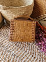 Bolsa Marrom Versus Bolsa Marrom Versus