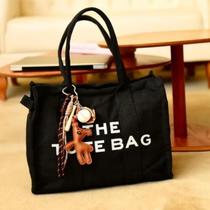 Bolsa The Toty em Lona com Chaveiro Bolsa The Toty em Lona com Chaveiro