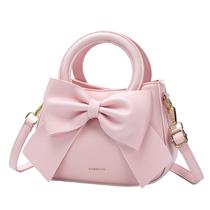Bolsa tiracolo CHERUTY pequena em material vegano com laço rosa