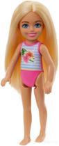 Boneca chelsea da barbie praia maiô florido