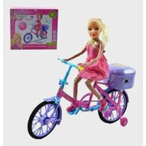 Boneca na Bicicleta A Pilha Com Luz E Som Anda Sozinha. e muito divertido.