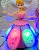 Boneca Small Angel Luz Musica Gira 360 graus.