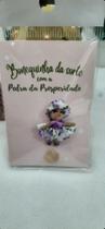 bonequinha da sorte com pedra da prosperidade